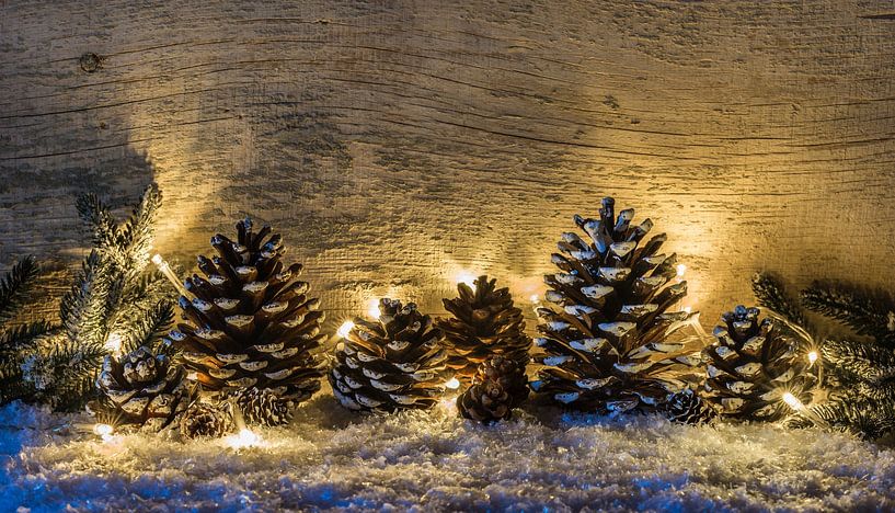 Christmas traditional decoration with pine cones, festive lights by Alex Winter