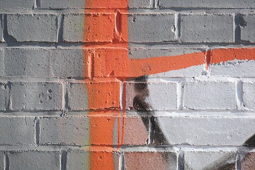 Detail van graffiti op de muur van een fabrieksgebouw