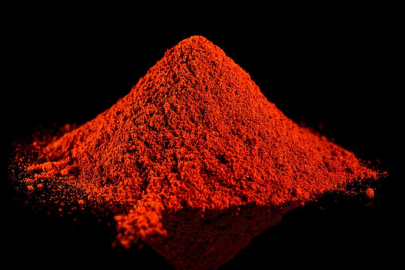 Ground red pepper on a black background by Sjoerd van der Wal Photography