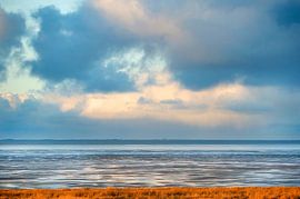 Clouds over Wadden Sea near Westhoek during low tide by Marcel van Kammen