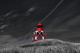 The lighthouse of the Frisian town of Stavoren in the evening light by Harrie Muis