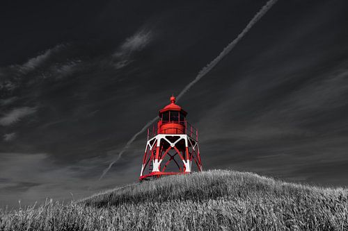 The lighthouse of the Frisian town of Stavoren in the evening light