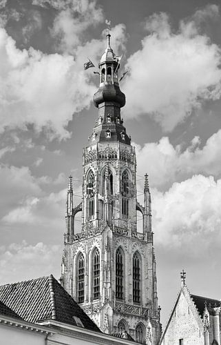 Ornate church tower against cloudy sky