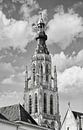 Ornate church tower against cloudy sky by Tony Vingerhoets thumbnail