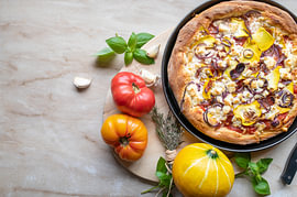Homemade pizza with fresh vegetables from the garden by Angelika Heine