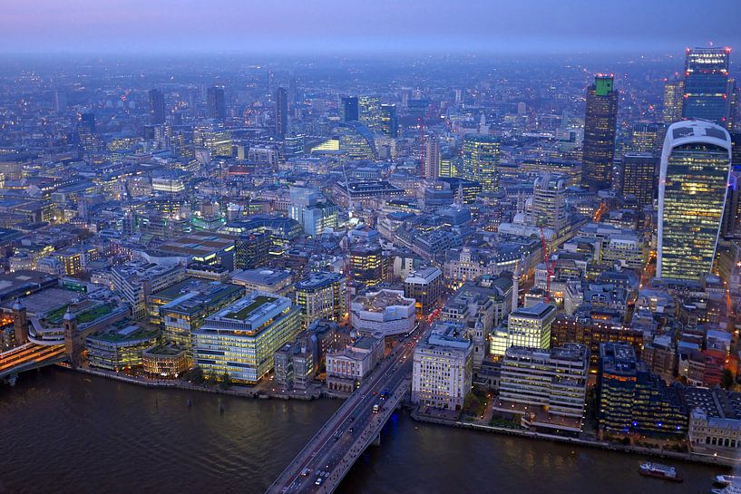 Aerial view of London at sunset with urban architecture and the River Thames in England by Eye on You