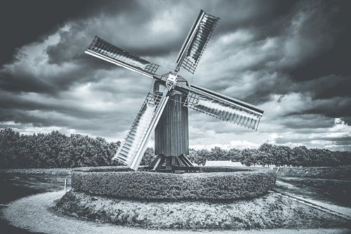 Old Windmill in action at dutch landscape