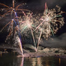 Fireworks on the ice lake Jokulsarlon  by Menno Schaefer