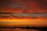 Beautiful red-orange sky just before sunrise over Amsterdam
