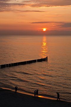 Sunset on shore of the Baltic Sea van Rico Ködder