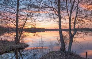 Calm water during sunset by Marcel Kerdijk