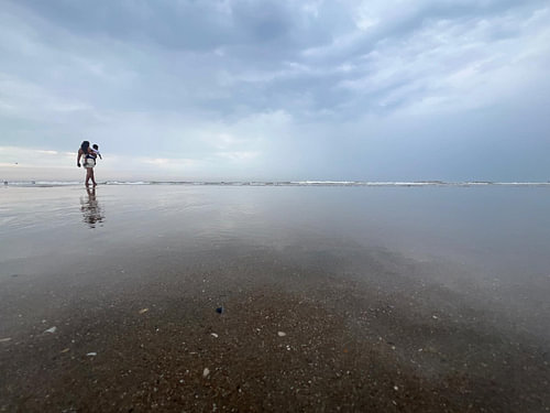 Serene Reflection – A Minimalist Walk on the Beach