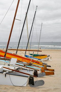 Catamarans at the shoreline. Noordwijk. by Alie Ekkelenkamp