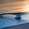 zonsopkomst achter de Zeelandbrug, de langste brug van Nederland van gaps photography