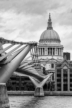 View of the Millennium Bridge over the River Thames with the dome of St. Paul's Cathedral in the bac