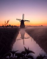 Mill in the fog in the early morning