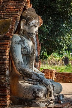 Statue in the temples of Ava in Myanmar by Roland Brack