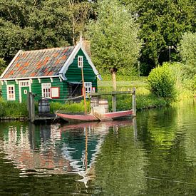Cottage with boat by matthijs iseger