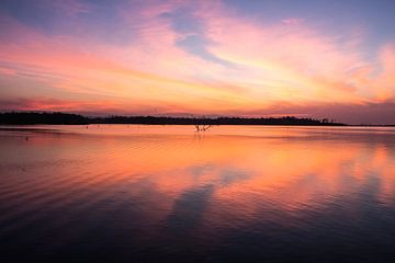 Beautiful lake at sunset by Anne Zwagers