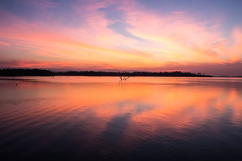 Beautiful lake at sunset by Anne Zwagers