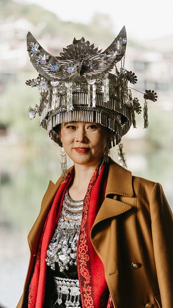 Portrait of a woman in traditional Miao dress, photographed in Fenghuang Ancient Town, Hunan, China. by Diederik De Mezel