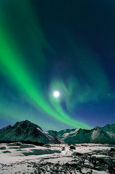 Aurora Northern Polar light in night sky over Northern Norway