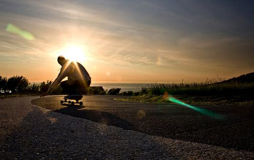 Beautiful photo longboarder with sunset 