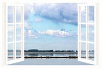 Uitzicht op het Grevelingenmeer gezien vanuit een raam