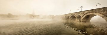 Saint Servatius bridge in Maastricht at morning fog, the Netherlands. by Frans Lemmens