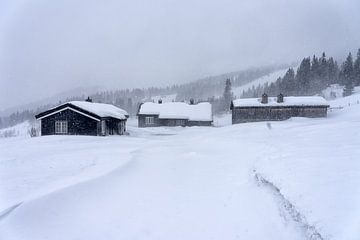 Huts in snowfall by Angelika Stern