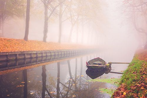 Autumn boat in the fog