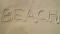 Beach written in the sand