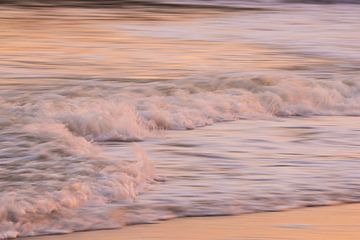 Sparkling water (skipping waves at the beach with warm morning light) by Birgitte Bergman