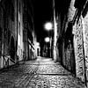 Alley by night by Steven Groothuismink