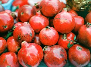 Colours of Marrakech - pomegranates on the market by Raisa Zwart
