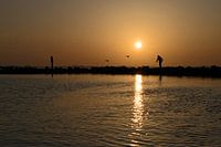 Sunset on the Grevelingen, walk over the breakwaters