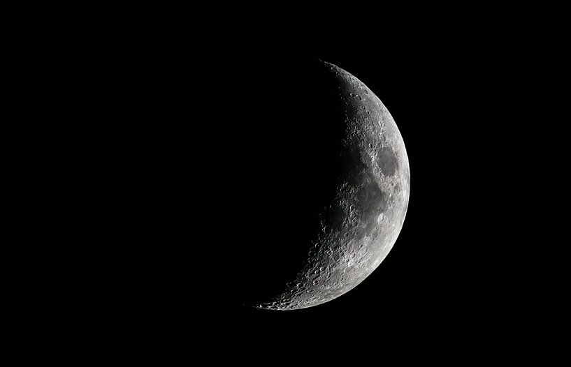 Moon with a clearly visible moon surface in the dark night sky. by Sjoerd van der Wal Photography