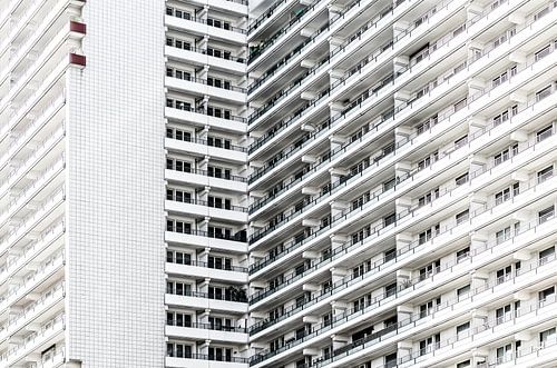 White façade structure with rhythmic balconies