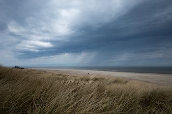 Coastline on vlieland with passing clouds & rain.