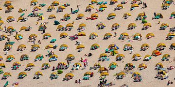 Aerial photo of bathers behind windbreaks by Frans Lemmens