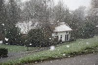 Dike house in snow shower