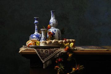 Still life Delft Blue with bread and fruit