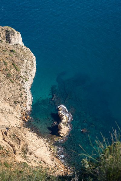 Rugged cliffs and turquoise blue sea water by Adriana Mueller