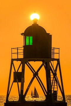 The lighthouse of Stavoren during sunset by Harrie Muis