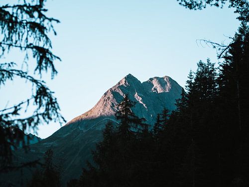 Mountain peak catching sunrise