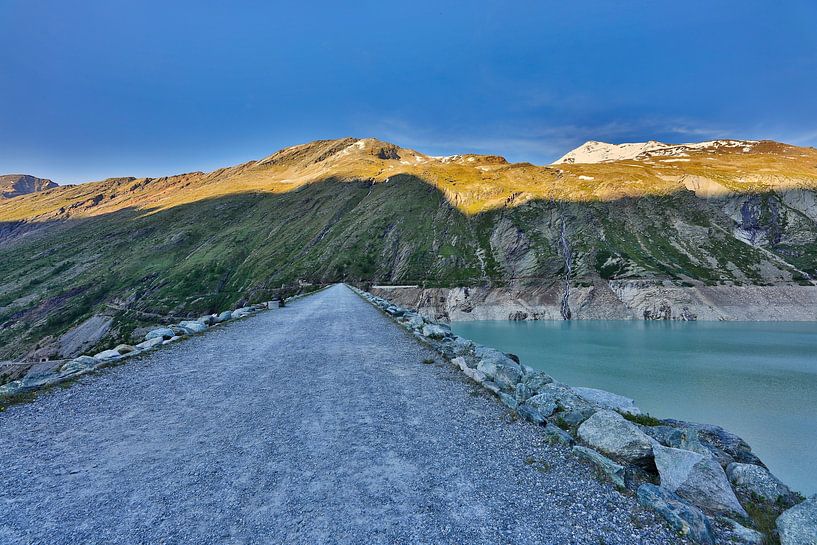 Mountain lake, path of light - the top of the dam of the Mattmark reservoir" by Dieter Fischer