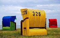 Red, blue and yellow beach chairs on the German Wadden Sea. by Alice Berkien-van Mil thumbnail