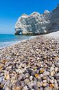 Shiny pebbles and chalk cliff, on the beach near Etretat by Paul van Putten thumbnail