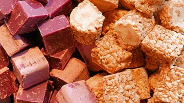 Close-up of chunks of nougat in different cheerful colors by Gert Bunt