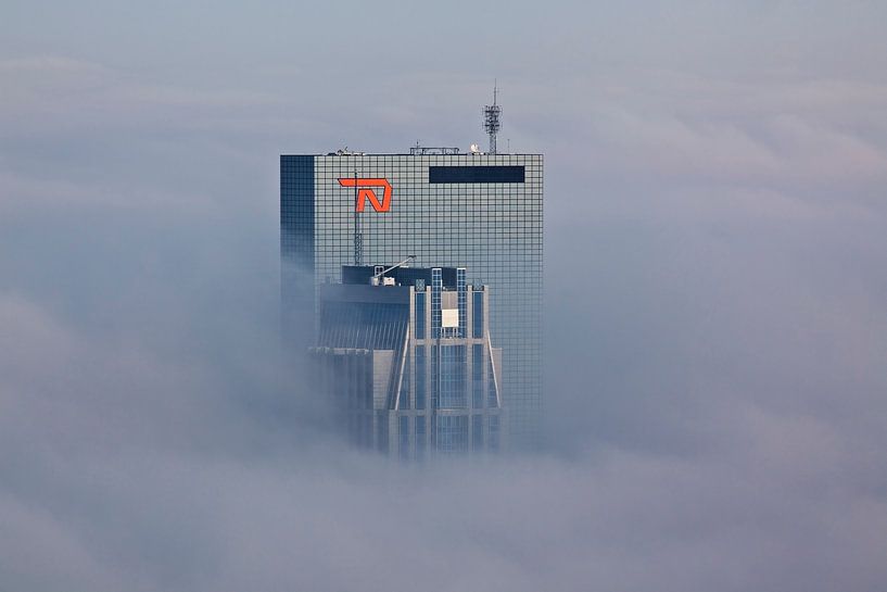Buildings poke through the fog in Rotterdam by Anton de Zeeuw